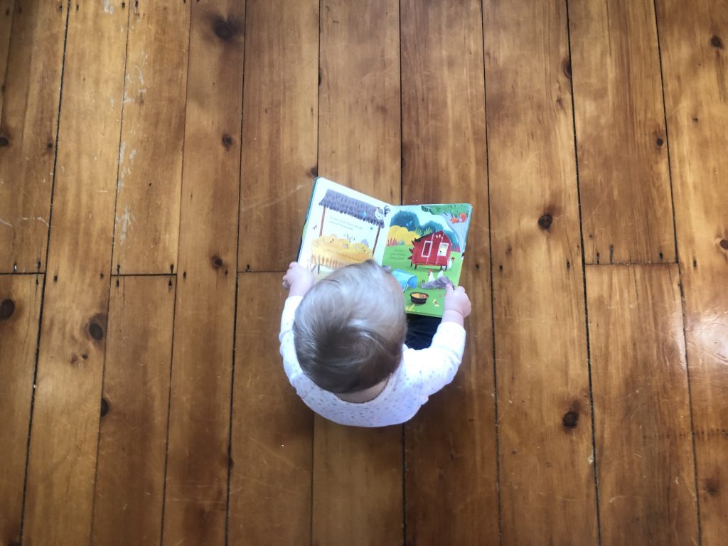 baby reading a book
